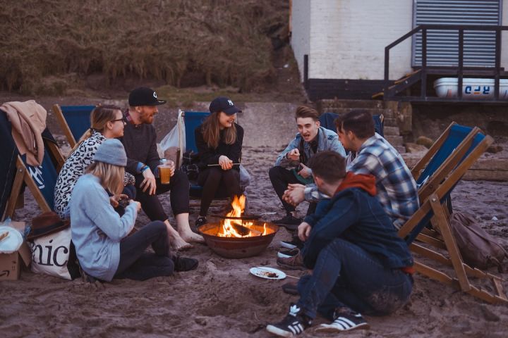 Camp - group of people sitting on front firepit