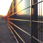 Fence - black metal fence during sunset