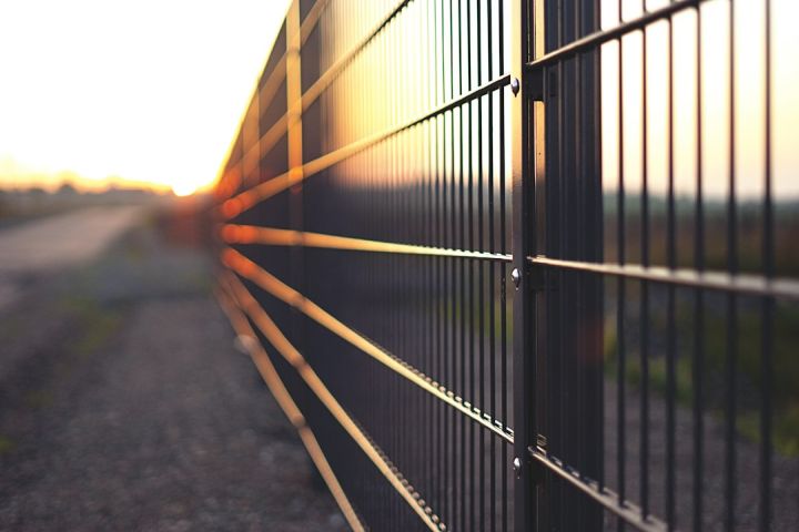 Fence - black metal fence during sunset